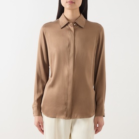 Model wearing Max Mara Studio tobacco silk shirt with point collar and button cuffs, styled with white trousers