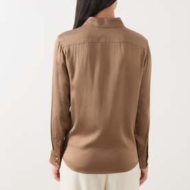 Model wearing Max Mara Studio tobacco silk shirt, rear view showing relaxed fit, button cuffs and classic collar detail.