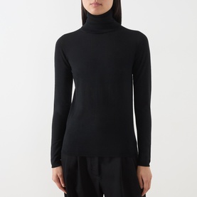 Model wearing Max Mara Main black wool turtleneck top with long sleeves and fitted silhouette, styled with black skirt.
