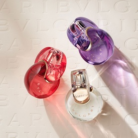 Bulgari Omnia Crystalline Eau de Toilette & Hand Cream Gift Set displayed with two other Omnia miniature bottles in red and purple on cream embossed