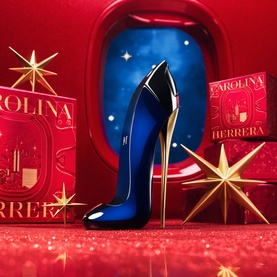 Carolina Herrera Good Girl Eau de Parfum Gift Set 50ml, iconic blue stiletto bottle with gold heel, festive red and gold star backdrop
