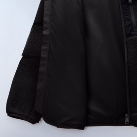 Napapijri children's jacket in Black Beauty, showing interior lining detail with contrast fleece panel and zip fastening