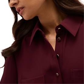 Model wearing Hobbs fig purple shirt, close-up of point collar and snap button fastening with chest pocket detail
