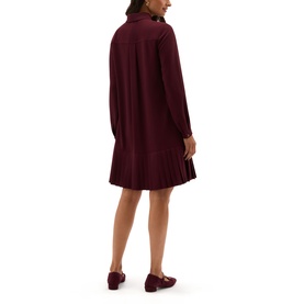 Model wearing Hobbs fig purple long-sleeve mini dress with pleated hem, shown from behind, styled with burgundy loafers