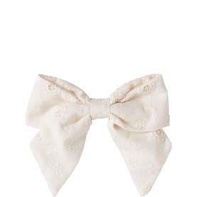 Lil Atelier turtledove bow clip with floral broderie anglaise fabric detail, long pointed tails