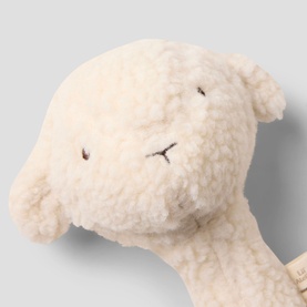 Lil Atelier turtledove plush soft toy, cream fluffy lamb with embroidered facial features, close-up detail shot