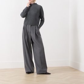 Model wearing Max Mara Studio Dark Grey wool-cashmere top with mock neck, styled with wide-leg grey trousers