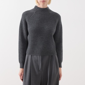 Model wearing Max Mara Studio dark grey wool-cashmere ribbed knit jumper with mock neck and raglan sleeves, styled with wide-leg trousers