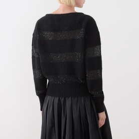 Model wearing Max Mara Studio Divo Metallic-Yarn Striped Sweater in black with shimmer stripe detail, styled with a black pleated skirt. Back view.