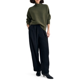 Model wearing Phase Eight dark green mock-neck sweatshirt with wide-leg black trousers and black heeled ankle boots