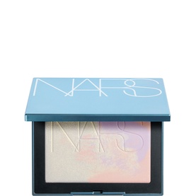 NARS Light Reflecting Prismatic Powder in Eternal Snow, compact pressed powder with iridescent pastel finish in blue packaging