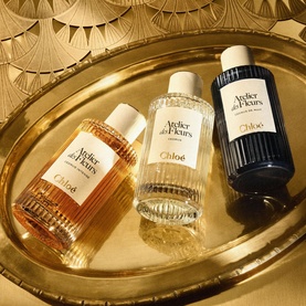 Chloe ADF Atelier des Fleurs Eau de Parfum & Hand Cream Gift Set, three bottles on gold tray with decorative backdrop