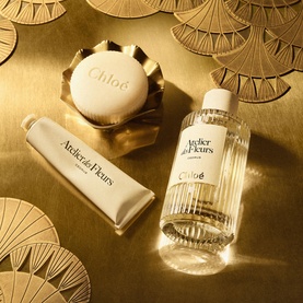 Chloe ADF Atelier des Fleurs Eau de Parfum & Hand Cream Gift Set with soap bar, styled on a gold surface with decorative fan motifs.