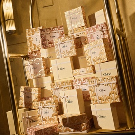 Chloe ADF Atelier des Fleurs Eau de Parfum & Hand Cream Gift Set displayed in gold setting with floral-patterned packaging sachets