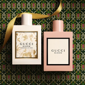Gucci Bloom Eau de Parfum and Perfumed Body Lotion Gift Set, pink and white bottles with floral detail on festive green patterned background
