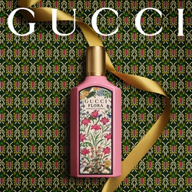 Gucci Flora Gorgeous Gardenia Eau de Parfum & Body Lotion Gift Set, pink floral bottle with gold cap, tied with ribbon on patterned background