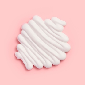 Bare by Vogue Self Tan Gradual cream texture swatch on pink background, showing white lotion consistency