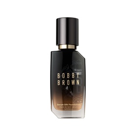 Bobbi Brown Serum Silk Foundation in a dark glass bottle with gold cap and gradient amber-to-black finish.