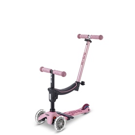Micro Scooters pink 3-in-1 mini scooter with adjustable T-bar handlebar, seat attachment, and light-up front wheels