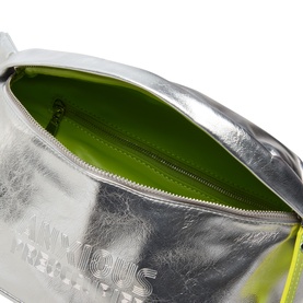 Anxious Preoccupied silver metallic crossbody bag, open to reveal lime green interior lining, with embossed logo detail.