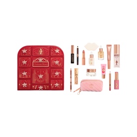 Charlotte Tilbury Beauty Advent Calendar, red star-embossed chest shown open with 12 make-up and skincare products including lipsticks