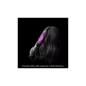 Model with Dyson Airwrap&trade; Origin Multi-Styler & Dryer in magenta, self-wrapping long dark hair using Coanda airflow technology.