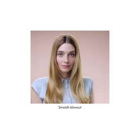 Model with sleek, straight smooth blowout hairstyle, wearing a light blue top against a soft pink background