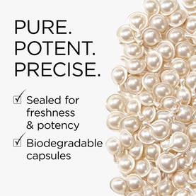 Elizabeth Arden biodegradable skincare capsules, sealed for freshness and potency, shown in a pile of cream-toned pearl-shaped capsules