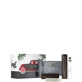 Rituals fragrance gift set with festive red truck box, soap bar, body spray, and mini fragrance bottle, presented with pine branch detail