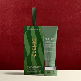 Elemis Nourish & Smooth Duo Gift Set with green wave-print gift bag and body butter tube on red background