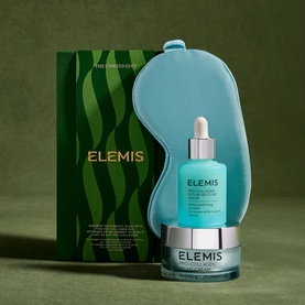 Elemis The Unwind Edit Gift Set with serum dropper, cream jar, teal sleep mask, and branded green gift box