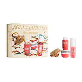 Sol De Janeiro Smooth & Bright Solidays Gift Set containing two coral-toned body products and a wooden massage brush