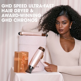 Model with GHD Deluxe Speed Hair Dryer and Chronos Straightener Festive Gift Set in Cashmere Beige, styled with gift box