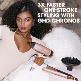 Model with GHD Deluxe Speed Hair Dryer and Chronos Straightener Festive Gift Set in Cashmere Beige, shown with diffuser attachment