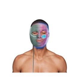 Model wearing Shark Beauty CryoGlow LED Face Mask Sage in green, shown with blue LED light activated on cheek
