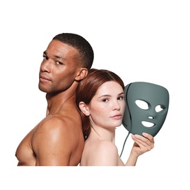 Two models with Shark Beauty CryoGlow LED Face Mask Sage in green, held up beside their faces against a white background.