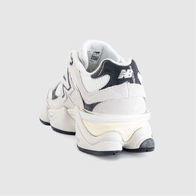 New Balance 9060 trainer in Reflection Sea Salt, chunky off-white sole, navy N logo detail, rear three-quarter view