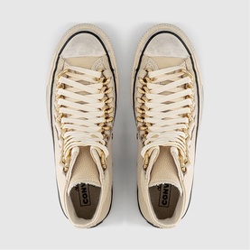 Converse high-top trainers in egret, overhead view showing gold chain-style laces, cream canvas upper and black sole edge.