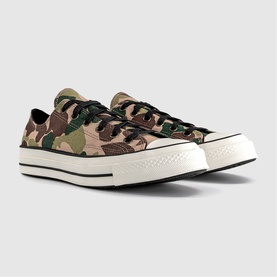 Converse Chuck 70 low-top trainers in green and brown camouflage canvas with black laces and off-white chunky sole