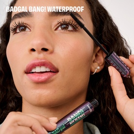 Model with Benefit Badgal Bang! Waterproof mascara, applying to lashes with wand, close-up beauty shot