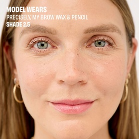 Model wearing Benefit Precisely, My Brow Wax & Pencil in Shade 2.5, showing defined natural brows and fresh skin