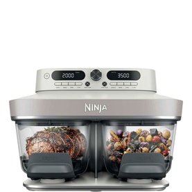 Ninja CRISPi DualZone 8-Function Glass Air Fryer in silver, dual transparent cooking chambers with digital controls, showing meat and vegetables