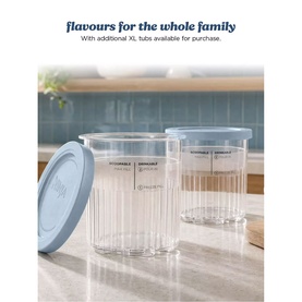 Ninja Ice Cream Maker 11-in-1 two clear ribbed 710ml tubs with blue lids on a kitchen countertop