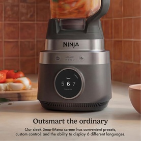 Ninja CrushBOSS Intelligent Blender 1200W in black with circular SmartMenu display showing presets, on a kitchen worktop.