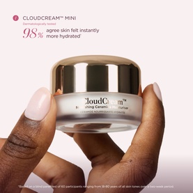 Sculpted by Aimee CloudCream Mini moisturiser held in model's hands, small gold-lidded cream jar with white packaging