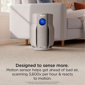 Shark Breathe Clear Compact Dove air purifier in light grey with blue digital display, shown in living room lifestyle setting