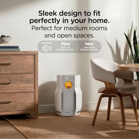 Shark Breathe Clear Compact Dove air purifier in light grey with amber filter indicator, shown in a styled living room setting.