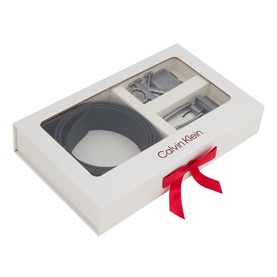 Calvin Klein Logo Belt Gift Set in black with antique silver hardware, two interchangeable buckles, presented in white gift box with red bow.