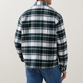 Model wearing Lacoste Casual Shirt in Flour colourway, green and white tartan check, rear view, styled with blue jeans