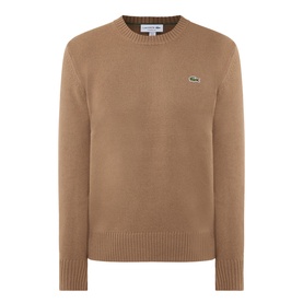 Lacoste crew neck wool jumper in cookie brown with ribbed cuffs, hem, and green crocodile logo badge on chest